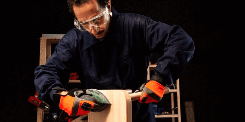  a short man using power tools while working